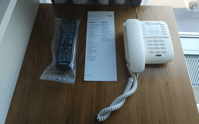 TV remote control, TV programme and hotel telephone