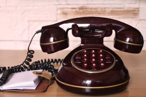 Canva - Maroon Push Button Telephone on Table