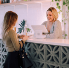 Hotel receptionist checking in a guest