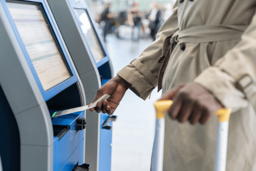 a person using a self-operated kiosk