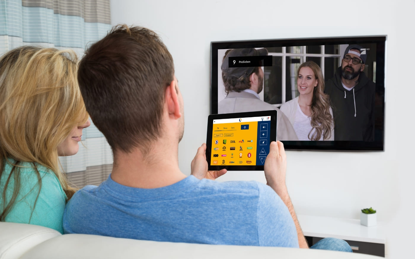 Two guests using SuitePad TV Control