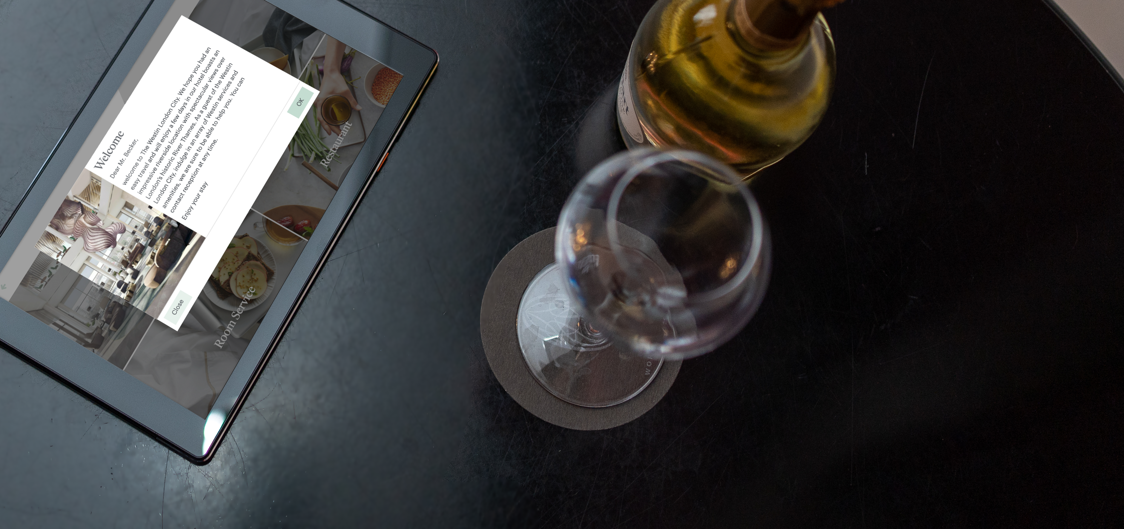 SuitePad in-room tablet with a push notification mock up on a table